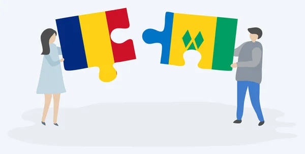 夫妇拿着两个拼图片与罗马尼亚和文森特国旗 罗马尼亚和圣文森特和格林纳丁斯国家象征在一起 — 图库矢量图片