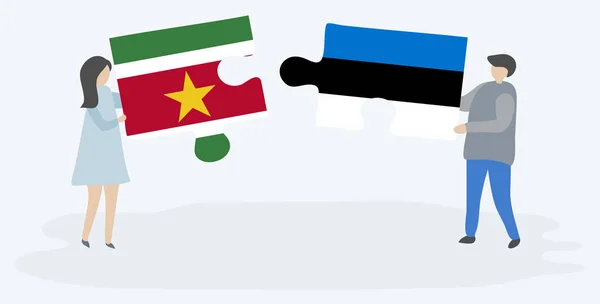 Pareja Sosteniendo Dos Piezas Rompecabezas Con Banderas Suriname Estonia Surinam — Vector de stock