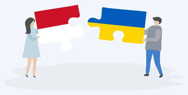 Para Trzyma Dwa Kawałki Puzzli Monegasque Ukraińskich Flag Symbole Narodowe — Wektor stockowy