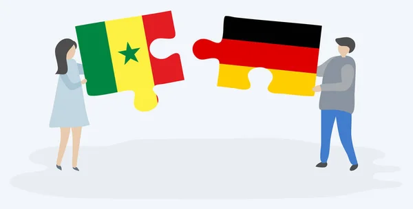 Casal Segurando Duas Peças Quebra Cabeças Com Bandeiras Senegalesas Alemãs — Vetor de Stock