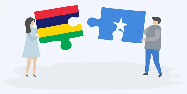 一对夫妇拿着两块拼图 上面挂着毛里求斯和索马里国旗 毛里求斯和索马里国家象征在一起 — 图库矢量图片