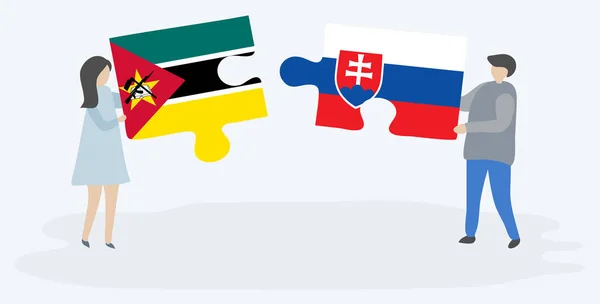 モザンビークとスロバキアの旗を持つ2つのパズルピースを保持しているカップル モザンビークとスロバキアの国のシンボル — ストックベクタ