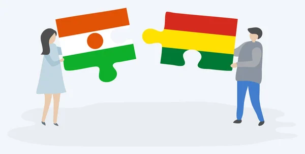 Paar Houden Twee Puzzels Stukken Met Nigerien Boliviaanse Vlaggen Niger — Stockvector