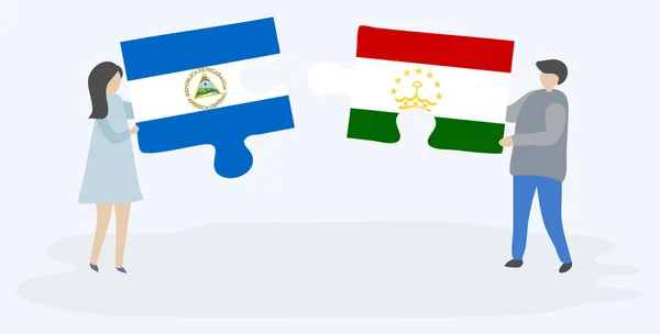 Paar Houden Twee Puzzels Stukken Met Nicaraguaanse Tajikistani Vlaggen Nicaragua — Stockvector