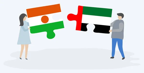 ナイジェリアとエミリアの旗を持つ2つのパズルピースを保持しているカップル ニジェールとアラブ首長国連邦のシンボル — ストックベクタ