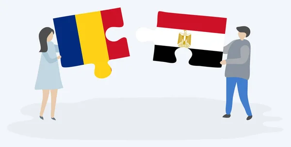 一对夫妇拿着两个拼图片与罗马尼亚和埃及国旗 罗马尼亚和埃及国家符号在一起 — 图库矢量图片