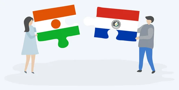 一对夫妇拿着两块拼图 上面挂着尼日尔和巴拉圭国旗 尼日尔和巴拉圭国家符号在一起 — 图库矢量图片