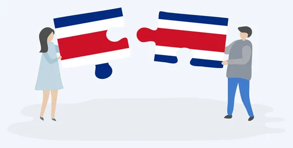 一对夫妇拿着两块拼图 上面挂着哥斯达黎加和哥斯达黎加国旗 哥斯达黎加和哥斯达黎加国家符号在一起 — 图库矢量图片