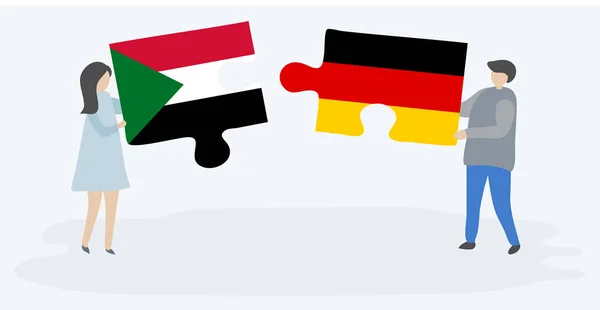 Pareja Sosteniendo Dos Piezas Rompecabezas Con Banderas Sudanesas Alemanas Sudán — Archivo Imágenes Vectoriales