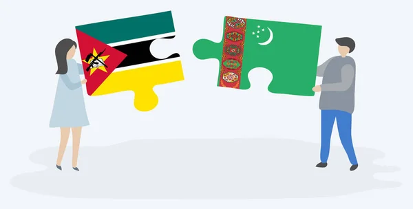 Paar Houden Twee Puzzels Stukken Met Mozambican Turkmeense Vlaggen Mozambique — Stockvector