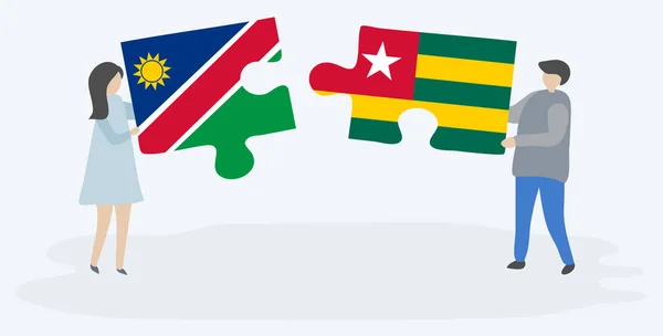 Pareja Sosteniendo Dos Piezas Rompecabezas Con Banderas Namibia Togo Namibia — Vector de stock