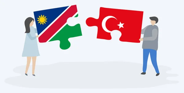 Pareja Sosteniendo Dos Piezas Rompecabezas Con Banderas Namibia Turquía Namibia — Vector de stock