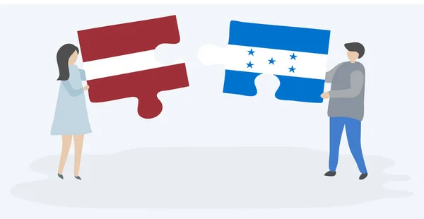 Dvojice Která Drží Dvě Skládanky Lotyšsky Honduranskou Vlajkou Národní Symboly — Stockový vektor