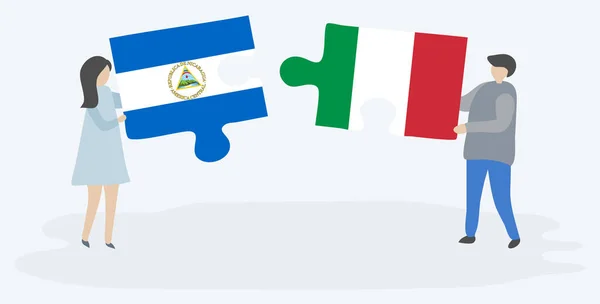 Para Trzyma Dwa Kawałki Puzzli Nikaraguan Włoskich Flag Nikaragua Włochy — Wektor stockowy