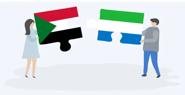 Pareja Sosteniendo Dos Piezas Rompecabezas Con Banderas Sudán Sierra Leona — Archivo Imágenes Vectoriales