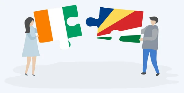 Pár Jich Drží Dvě Skládanky Vlajkami Ivoriane Seychellois Národní Symboly — Stockový vektor