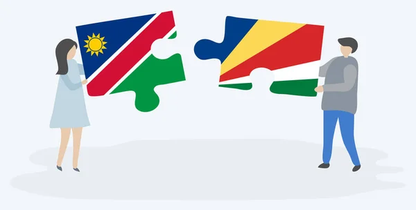 Pareja Sosteniendo Dos Piezas Rompecabezas Con Banderas Namibia Seychelles Namibia — Vector de stock