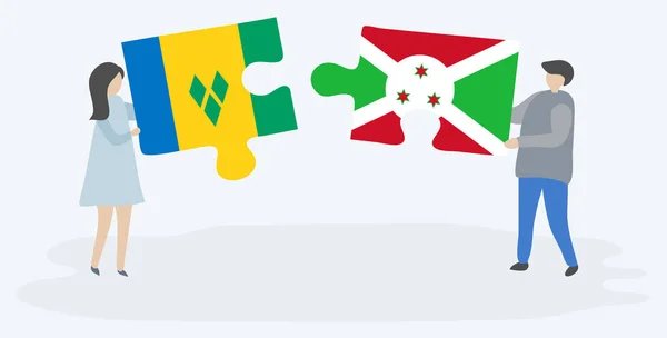 一对夫妇拿着两块拼图 上面挂着文森特和布隆迪国旗 圣文森特和格林纳丁斯和布隆迪国家象征在一起 — 图库矢量图片