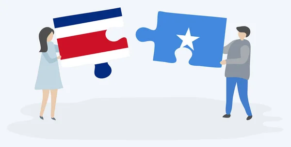 Pareja Sosteniendo Dos Piezas Rompecabezas Con Banderas Costa Rica Somalia — Archivo Imágenes Vectoriales