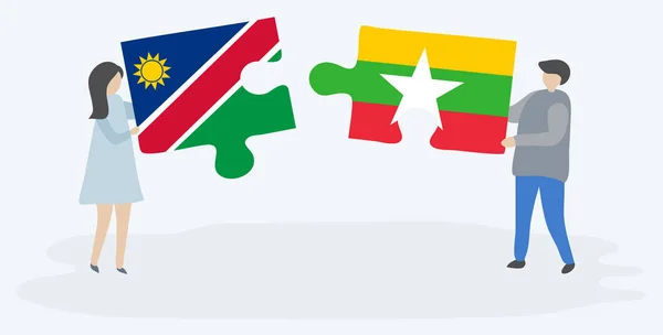Pareja Sosteniendo Dos Piezas Rompecabezas Con Banderas Namibia Birmania Namibia — Vector de stock