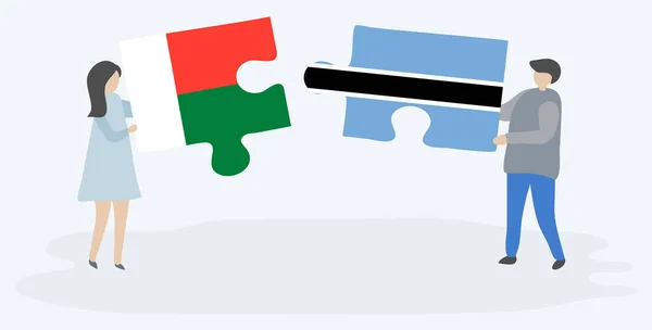 Пара Держащая Две Головоломки Малагасийскими Моцванскими Флагами Мадагаскар Ботсвана Вместе — стоковый вектор