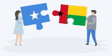 Çift Somali ve Bissau-Gine bayrakları ile iki bulmaca parçaları tutan. Somali ve Gine-Bissau ulusal sembolleri birlikte.