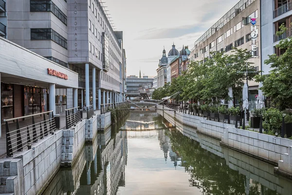 Buildings along the canal at downtown Aarhus, reflecting in the — Stok fotoğraf