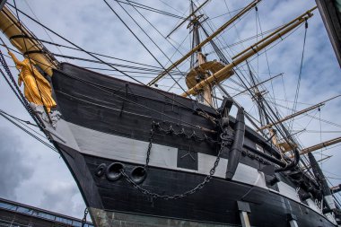 The frigate Jylland with the golden figurehead  and anchor against the blue sky, Ebeltoft, September 9, 2019