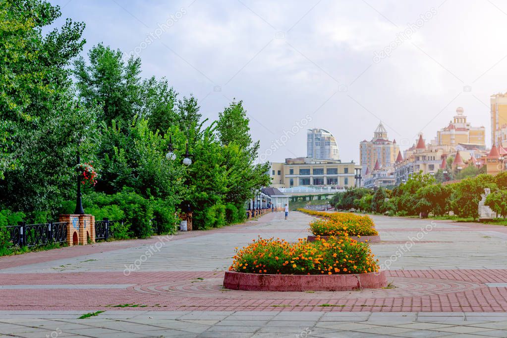 Kiev. Broad Quay Summer with flower beds in the area Obolon along the Dnieper River.Focus on the front flower bed