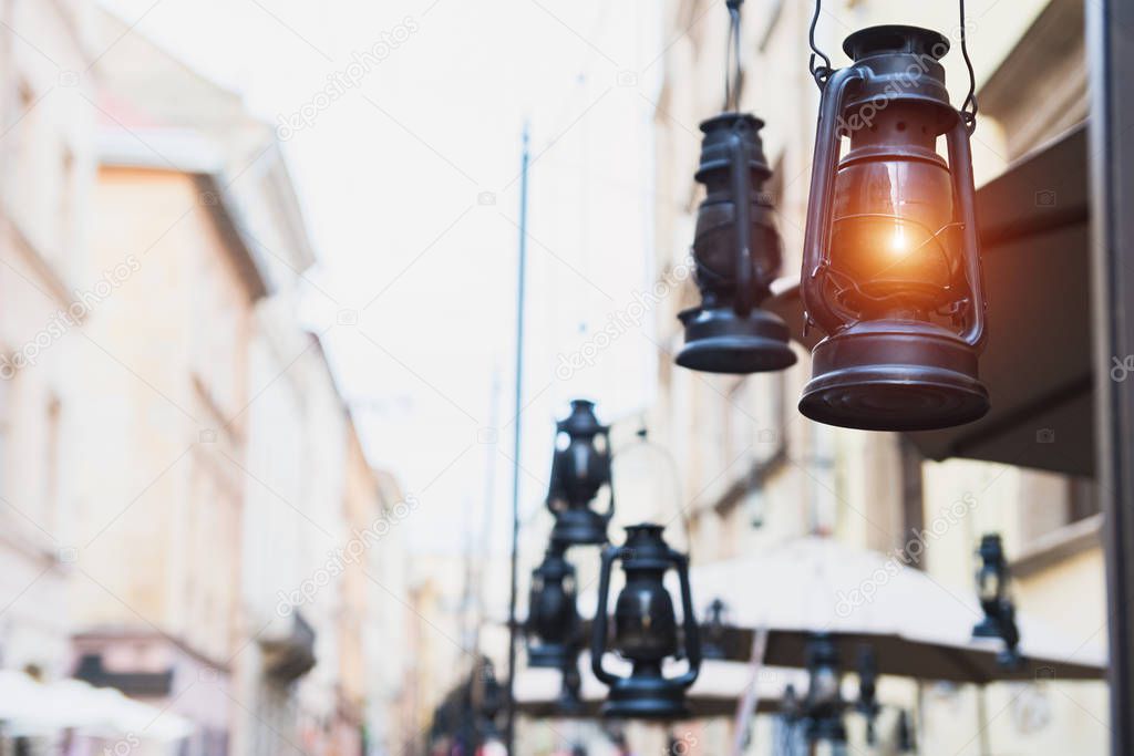 Old oil lamps hang on the street