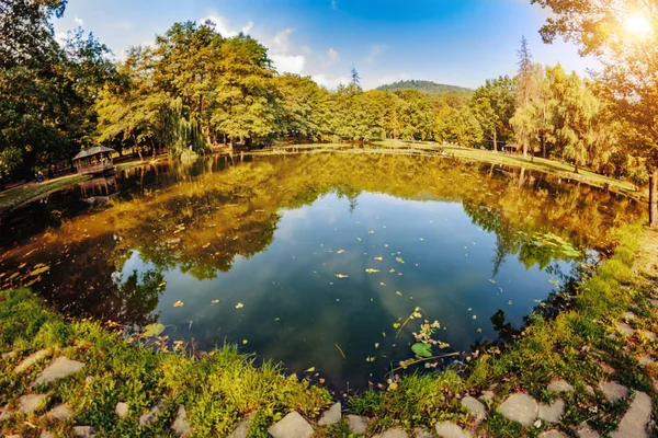 Swiss Lake in the park of Schonborn Castle in the Carpathians, Ukraine. The source of youth and beauty with healing water