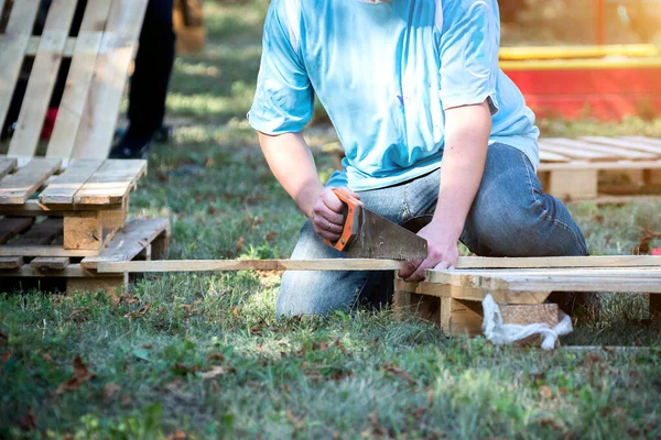 Making outdoor furniture from pallets.