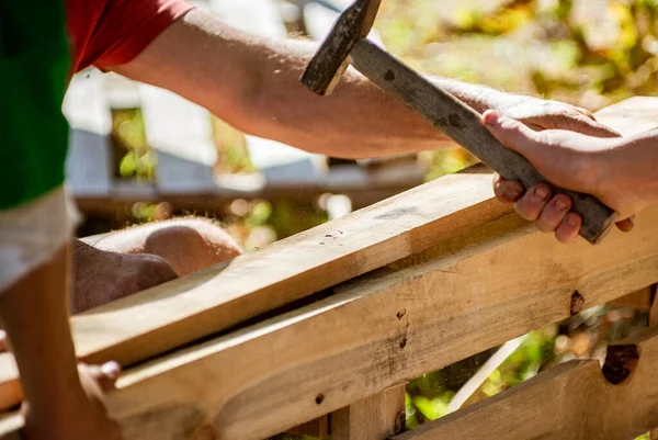 Making outdoor furniture from pallets.