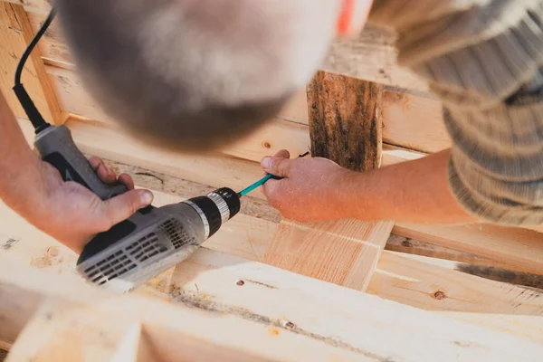 Making outdoor furniture from pallets.