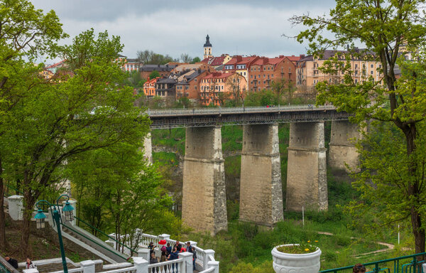 Kamenetz-Podolsky, Ukraine - April 29, 2019: High stone bridge in the old town of Kamenetz-Podolsk.