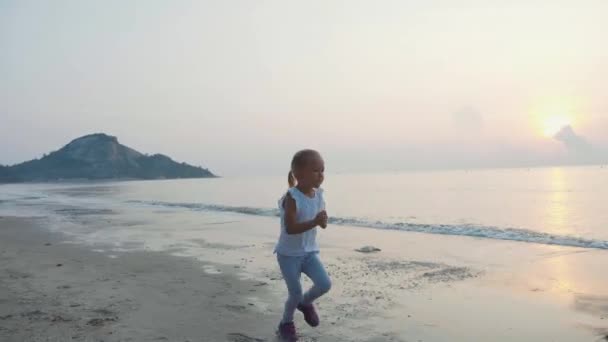 Steadicam Shot Little Cute Child Girl Jogging Beach Sunrise — Stock Video