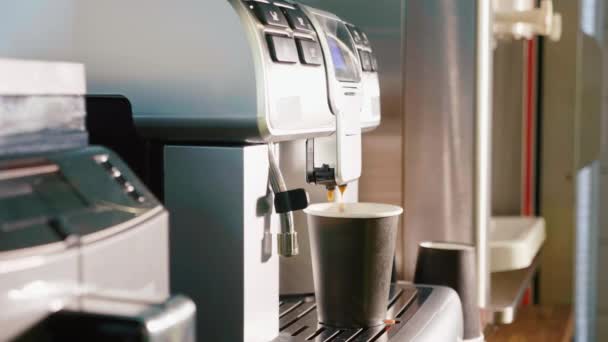 Process of making coffee by coffee machine pour coffee into the cup — Stock Video