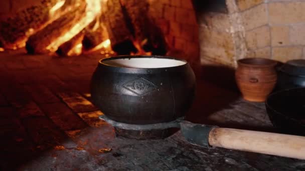 Traditional Russian stove with cooking food on wood in crock — Stock Video