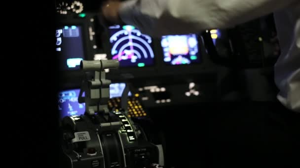 Captain is controls the airplane, rear view. — Stock Video