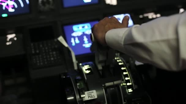 Captain is controls the airplane, rear view. — Stock Video