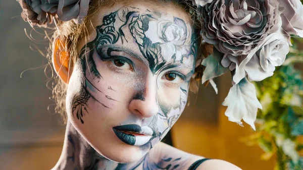 Halloween face art. Portrait of beautiful woman with halloween make up — Stock Photo, Image
