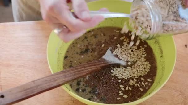 Cook mixes ingredients for dough in plastic bowl — Stock video