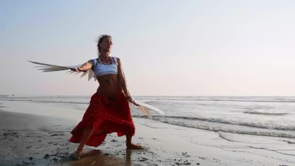 Young girl with angel wings dancing at sunset — Stock Video