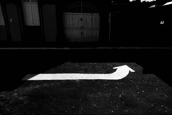 Horizontal traffic signs on an asphalt street in Guarani, state of Minas Gerais, Brazil.