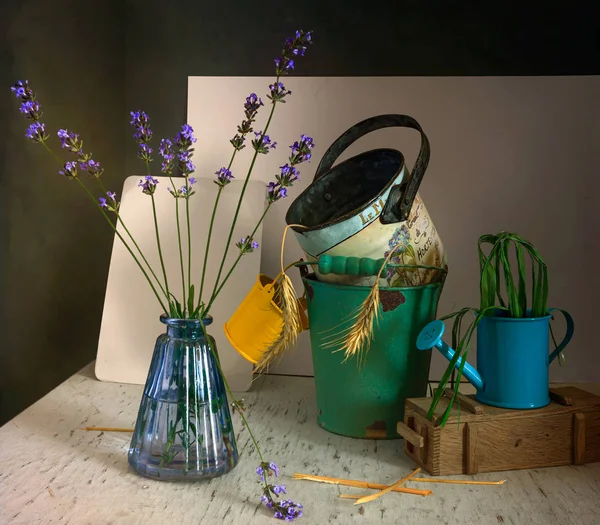 still life with lavender, watering can and small buckets.
