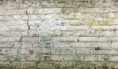 Parçalanmış alçılı eski tuğla işi. Bina duvarı. Grafiksel kaynaklar. Geçmişi. Eski model. Retro.