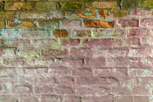 Old brickwork with crumbling plaster. Building wall. Graphic resources. Background. Vintage. Retro.