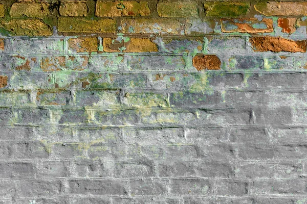 Old brickwork with crumbling plaster. Building wall. Graphic resources. Background. Vintage. Retro.