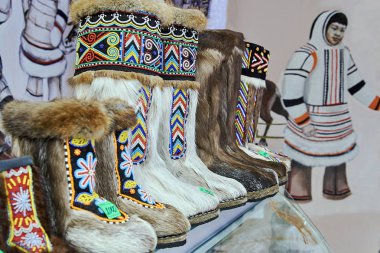 NORILSK, RUSSIA - JULY 7, 2016: Shoes of indigenous northern peoples on the shop. clipart