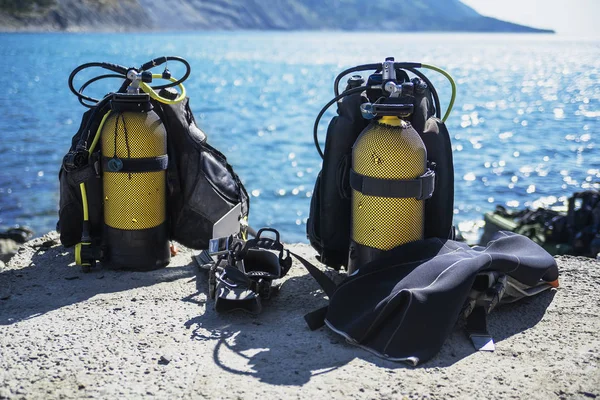 diving equipment lies cooked on the beach